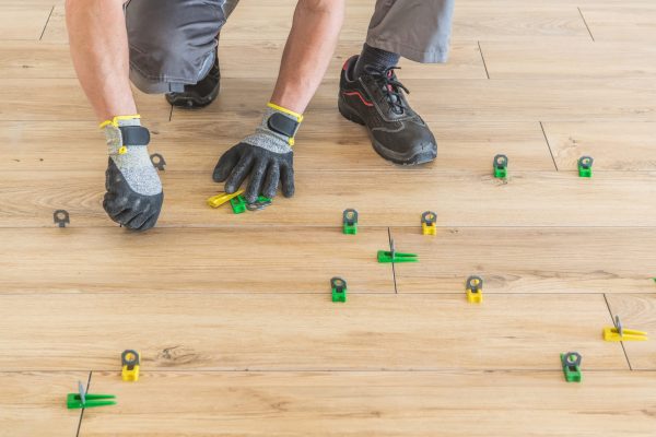 New Modern and Stylish Wooden Like Ceramic Floor Installed by Professional Remodeling Worker.